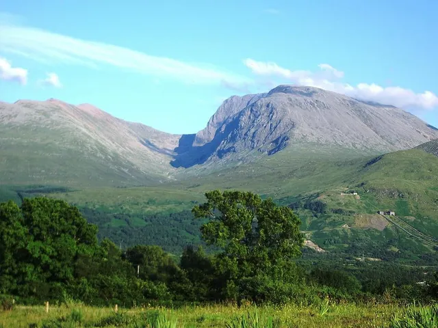 Ben Nevis's massive bulk and north-face cliffs above Scottish moorland