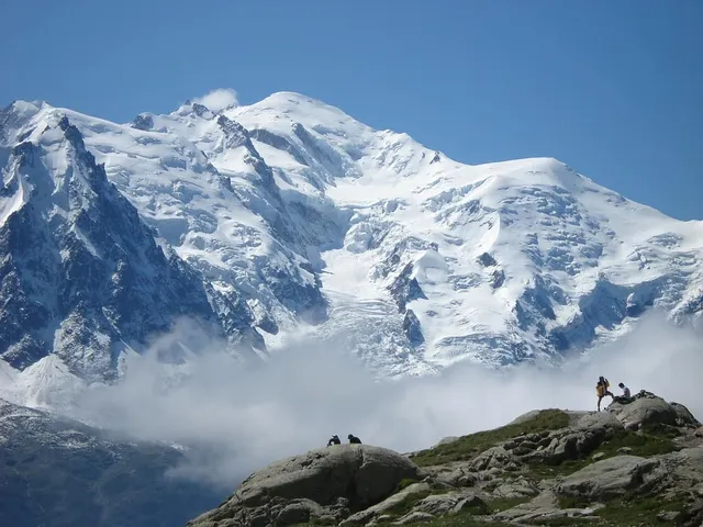 Mont Blanc's rounded snow dome above the Chamonix aiguilles
